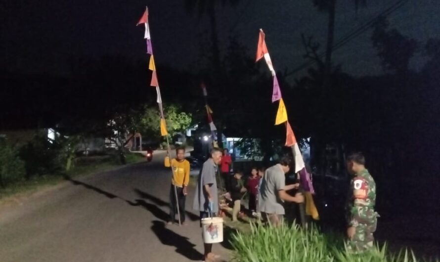 Meriahkan HUT RI, Babinsa bersama Perangkat Desa Ajak Warga Pasang Bendera Merah Putih